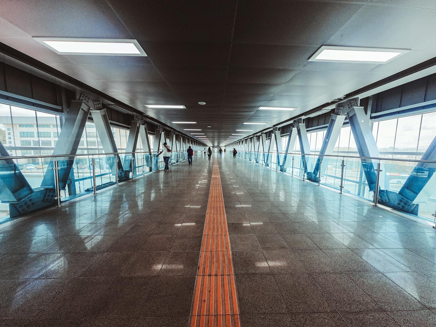 people walking inside tunnel